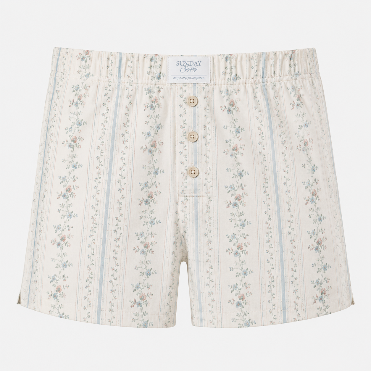 Floral patterned shorts with button details on a white background