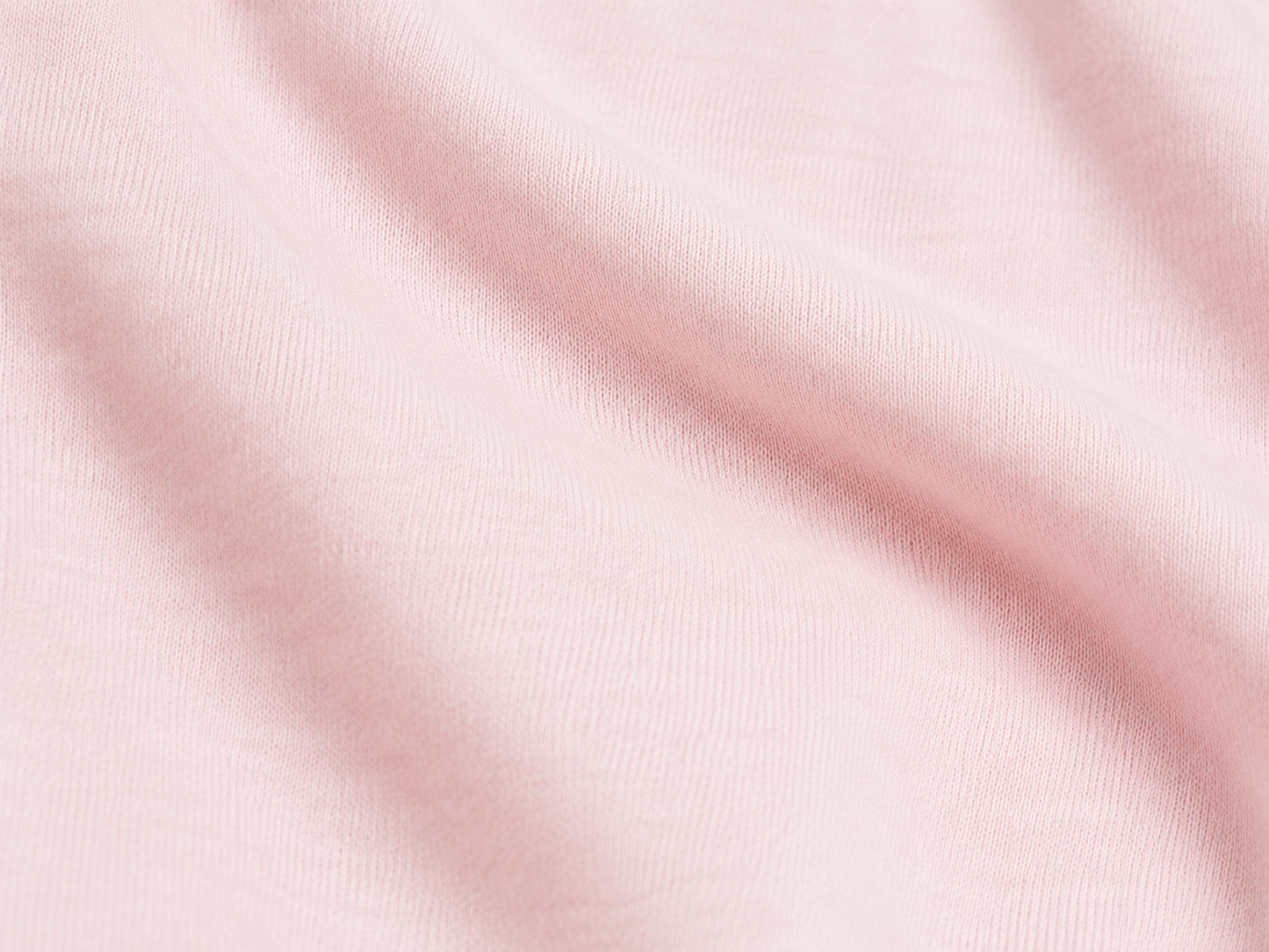 Pink fabric texture with soft folds